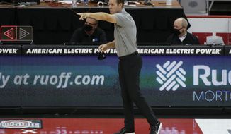 Nebraska coach Fred Hoiberg instructs the team during the first half of an NCAA college basketball game against Ohio State on Wednesday, Dec. 30, 2020, in Columbus, Ohio. (AP Photo/Jay LaPrete)