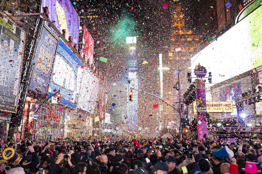 In this Jan. 1, 2020, file photo, confetti falls at midnight on the Times Square New Year's Eve celebration in New York. Crowds will once again fill New York's Times Square this New Year's Eve, with proof of COVID-19 vaccination required for revelers who want to watch the ball drop in person, Mayor Bill de Blasio announced Tuesday. (Photo by Ben Hider/Invision/AP, File) **FILE**