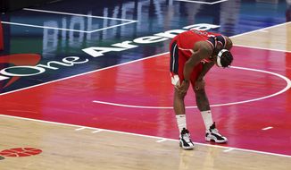 Washington Wizards&#39; Bradley Beal reacts after being called for a foul during the closing seconds of the team&#39;s 133-130 loss to the Chicago Bulls in an NBA basketball game Thursday, Dec. 31, 2020, in Washington. (Rob Carr/Pool Photo via AP)