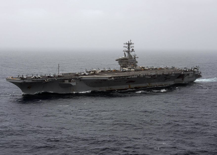 In this Sept. 7, 2020, file photo released by the U.S. Navy, the aircraft carrier USS Nimitz transits the Arabian Sea. (Mass Communication Specialist 3rd Class Elliot Schaudt/U.S. Navy via AP) ** FILE **