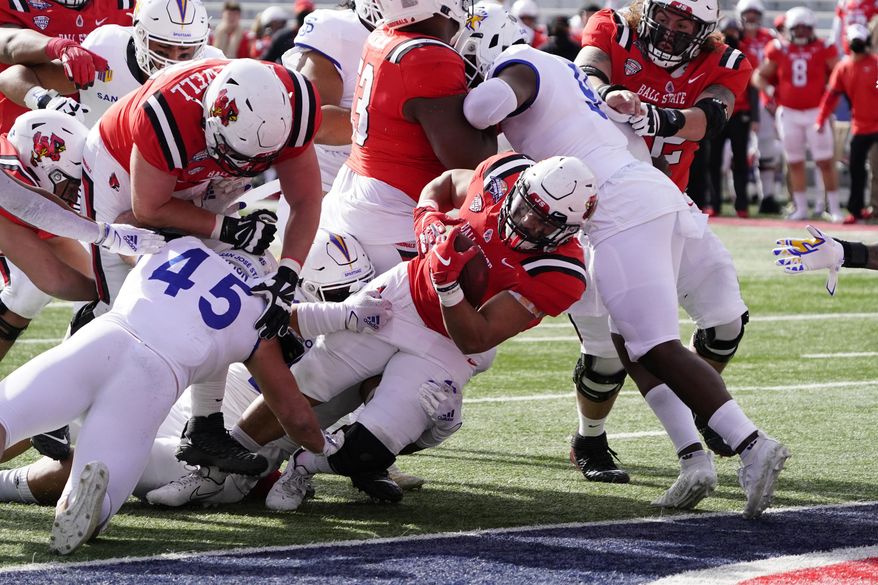 Ball State running back Tye Evans (30) scores a touchdown against San Jose State in the first half of the Arizona Bowl NCAA college football game, Thursday, Dec. 31, 2020, in Tucson, Ariz. (AP Photo/Rick Scuteri)