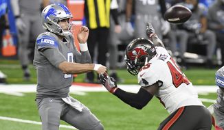 Detroit Lions quarterback Matthew Stafford (9) throws as Tampa Bay Buccaneers inside linebacker Devin White (45) rushes during the first half of an NFL football game, Saturday, Dec. 26, 2020, in Detroit. (AP Photo/Lon Horwedel)