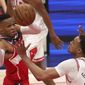 Washington Wizards&#39; Russell Westbrook passes the ball around Chicago Bulls&#39; Daniel Gafford, right, during the first half of an NBA basketball game Thursday, Dec. 31, 2020, in Washington. (Rob Carr/Pool Photo via AP)