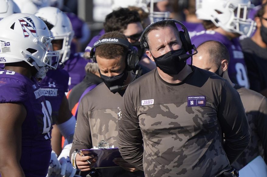 FILE - In this Saturday, Nov. 7, 2020, file photo, Northwestern head coach Pat Fitzgerald looks at the scoreboard during the second half of an NCAA college football game against Nebraska in Evanston, Ill. No. 15 Northwestern plays against Auburn in the Citrus Bowl on Friday, Jan. 1, 2021. (AP Photo/Nam Y. Huh, File)