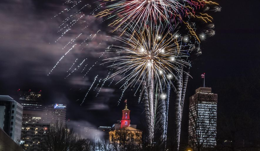 In this Dec. 31, 2019 photo,  fireworks explode over Bicentennial Mall during the Jack Daniel&#39;s Music City Midnight New Year&#39;s Eve celebration in Nashville, Tenn.  The Christmas morning bombing of the downtown tourist district forced organizers of what was already slated to be a very muted New Year’s celebration to dial it back even further. Nashville had already canceled its outdoor public concert for a televised one. But organizers had hoped to blow up a 2020 number and have fireworks as a way to say good riddance to a terrible year. (Alan Poizner/The Tennessean via AP)
