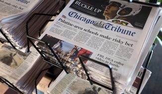 FILE - In this Monday, April 25, 2016, file photo, Chicago Tribune and other newspapers are displayed at Chicago&#x27;s O&#x27;Hare International Airport.  Hedge fund Alden, Tribune’s largest shareholder, has offered to buy the rest of the newspaper publisher, Thursday, Dec. 31, 2020,  at a price that values it at $520.6 million.   (AP Photo/Kiichiro Sato, File)