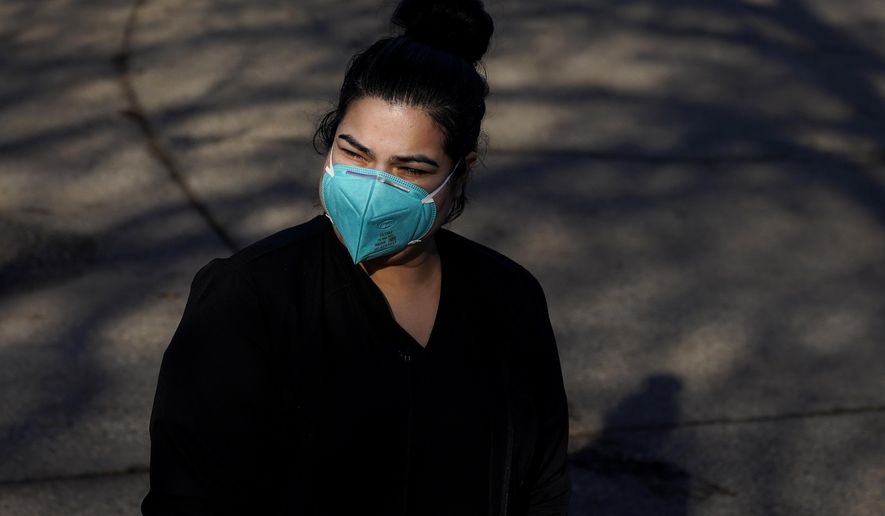 Lily Guido poses for photos in Sebastopol, Calif., Monday, Dec. 21, 2020. Taxpayers in families that include immigrants in the country illegally are celebrating the December federal relief bill after being excluded from the April relief stimulus. (AP Photo/Jeff Chiu)