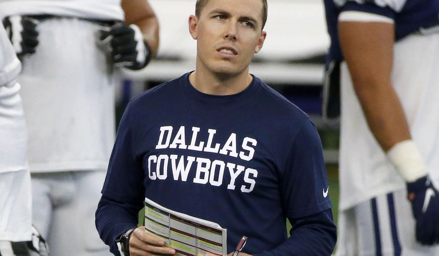 FILE - In this Aug. 30, 2020, file photo, Dallas Cowboys offensive coordinator Kellen Moore watches practice during an NFL football training camp in Arlington, Texas. Moore said Saturday, Jan. 2, 2021, he is no longer pursuing the Boise State job, and the Cowboys signed their play-caller to a multiyear contract extension. (AP Photo/Michael Ainsworth, File)