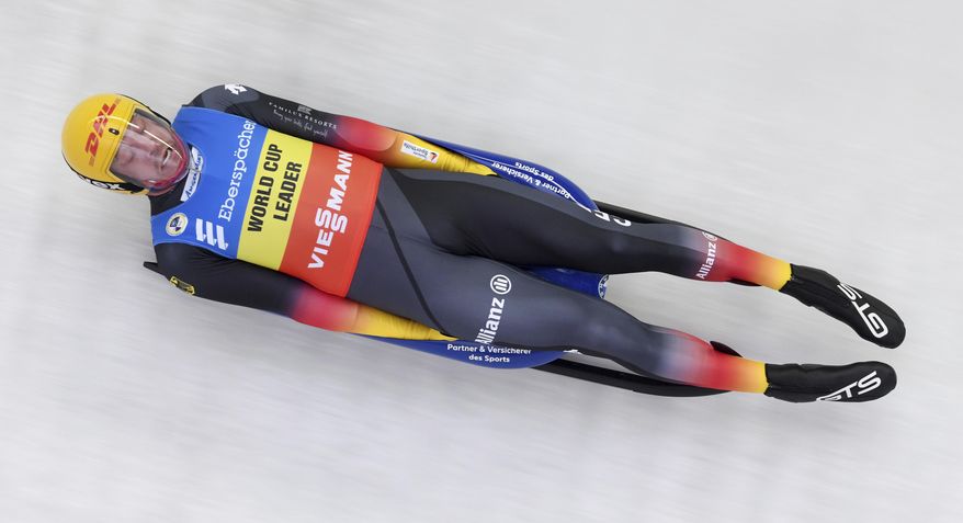 Germany's Felix Loch slides down the track during the men's single luge world cup race in Schoenau at the Koenigssee, Germany, Saturday, Jan. 2, 2021. (Tobias Hase/dpa via AP)