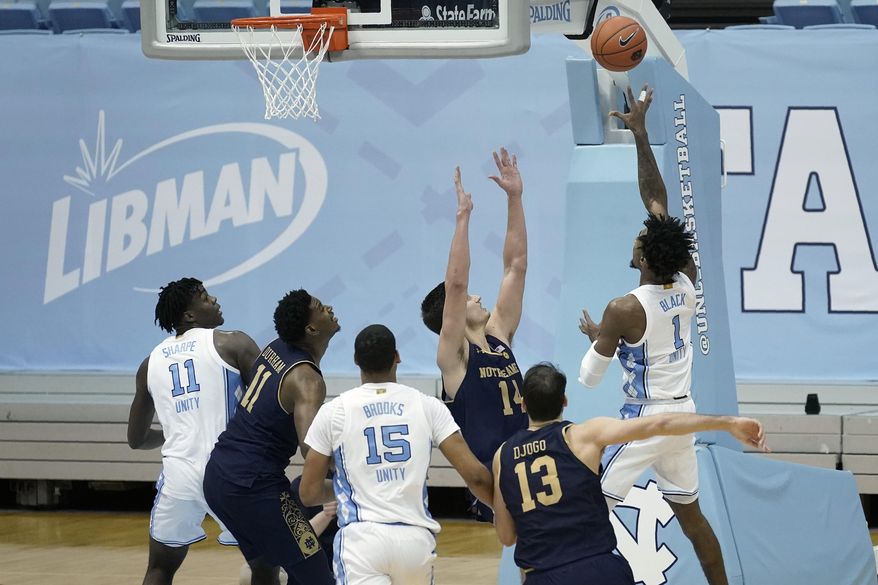 North Carolina guard Leaky Black (1) takes a shot to give his team the lead against Notre Dame late in the second half of an NCAA college basketball game in Chapel Hill, N.C., Saturday, Jan. 2, 2021. (AP Photo/Gerry Broome)