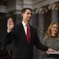 Vice President Mike Pence administers the oath of office to Sen. Tom Cotton, R-Ark., as his wife Anna Peckham holds a Bible, during a reenactment ceremony in the Old Senate Chamber at the Capitol in Washington, Sunday, Jan. 3, 2021. (Kevin Dietsch/Pool via AP)