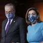 In this Thursday, Nov. 12, 2020 file photo, Speaker of the House Nancy Pelosi, D-Calif., and Senate Minority Leader Chuck Schumer, D-N.Y., meet with reporters on Capitol Hill in Washington. (AP Photo/J. Scott Applewhite, File) ** FILE **