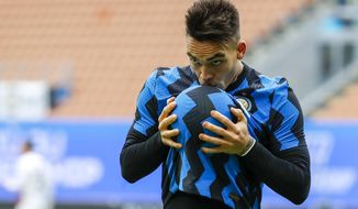 Inter Milan&#39;s Lautaro Martinez celebrates after he scored his side&#39;s third goal during the Serie A soccer match between Inter Milan and Crotone at the San Siro Stadium in Milan, Italy, Sunday, Jan. 3, 2021. (AP Photo/Antonio Calanni)