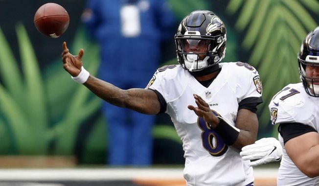 Baltimore Ravens quarterback Lamar Jackson (8) passes against the Cincinnati Bengals during the first half of an NFL football game, Sunday, Jan. 3, 2021, in Cincinnati. (AP Photo/Aaron Doster)