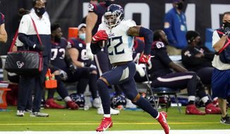 Tennessee Titans running back Derrick Henry (22) runs for a first down against the Houston Texans during the second half of an NFL football game Sunday, Jan. 3, 2021, in Houston. (AP Photo/Sam Craft)