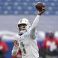 Miami Dolphins quarterback Tua Tagovailoa (1) passes in the second half of an NFL football game against the Buffalo Bills, Sunday, Jan. 3, 2021, in Orchard Park, N.Y. (AP Photo/Adrian Kraus)