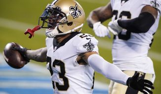 New Orleans Saints cornerback Marshon Lattimore celebrates after an interception during the second half of an NFL football game against the Carolina Panthers Sunday, Jan. 3, 2021, in Charlotte, N.C. (AP Photo/Brian Blanco)
