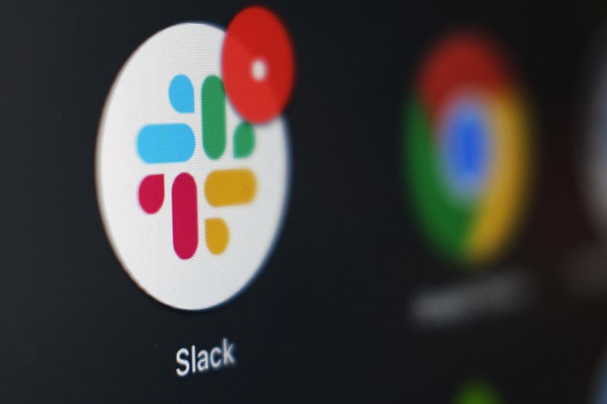 This Dec. 2, 2020, file photo shows the Slack app icon being displayed on a computer screen in Tokyo. Slack suffered a global outage Monday, Jan. 4, 2021, during the first day back to work for most people after the New Year’s holiday. Users reported service was down in the U.S., Asia, Latin America Europe and India. (AP Photo/Kiichiro Sato, File)