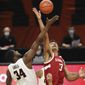 Stanford&#39;s Oscar da Silva (13) and Oregon State&#39;s Rodrigue Andela (34) go up for the tip-off during the first half of an NCAA college basketball game in Corvallis, Ore., Monday, Jan. 4, 2021. (AP Photo/Amanda Loman)