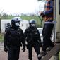 In this photo providedby the French Gendarmerie, a man exists a vehicle after being checked by gendarmes, near Lieuron, Brittany, France, Saturday, Jan. 2, 2021. A French prosecutor said police detained seven people Saturday, including two alleged organizers, after a New Year&#x27;s Eve rave party drew at least 2,500 people in western France despite a coronavirus curfew and other restrictions. (Gendarmerie Nationale via AP)