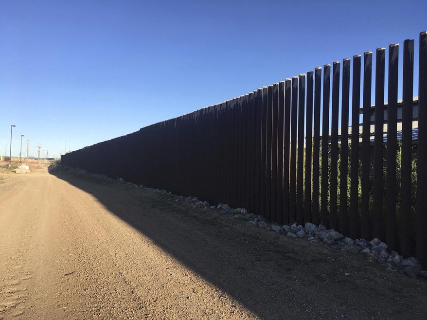 A border fence located in Columbus, New Mexico, provides a sharp demarcation between the United States and Mexico. (Associated Press)