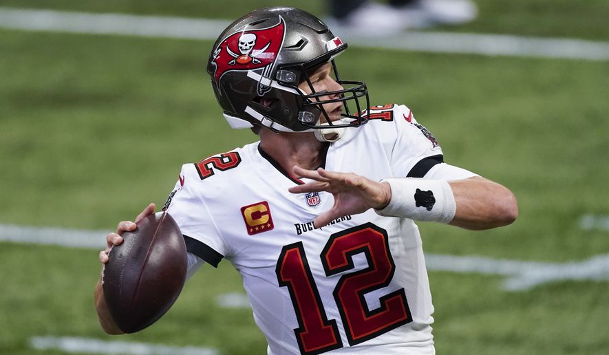 Tampa Bay Buccaneers quarterback Tom Brady (12) warms up before the first half of an NFL football game between the Atlanta Falcons and the Tampa Bay Buccaneers, Sunday, Dec. 20, 2020, in Atlanta. (AP Photo/John Bazemore)