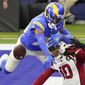 Los Angeles Rams cornerback Jalen Ramsey (20) defends a pass intended for Arizona Cardinals wide receiver DeAndre Hopkins (10) during the second half of an NFL football game in Inglewood, Calif., Sunday, Jan. 3, 2021. (AP Photo/Jae C. Hong)