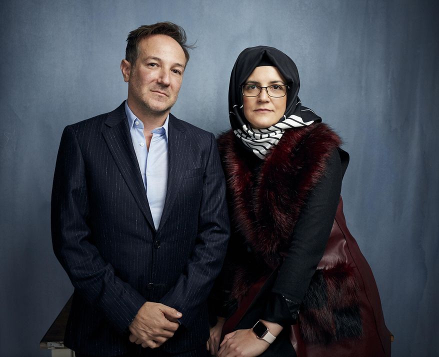 FILE - Director Bryan Fogel, left, and  Hatice Cengiz pose for a portrait to promote &amp;quot;The Dissident,&amp;quot; a film about slain journalist Jamal Khashoggi, during the Sundance Film Festival  in Park City, Utah on Jan. 24, 2020. (Photo by Taylor Jewell/Invision/AP, File)