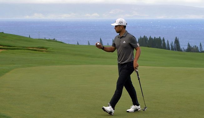 FILE - Xander Schauffele acknowledges the gallery after putting on the fourth green during the third round of the Tournament of Champions golf event at Kapalua Plantation Course in Kapalua, Hawaii, in this Saturday, Jan. 4, 2020, file photo. Schauffele is among 16 players in the Tournament of Champions who didn&#x27;t win last year. (AP Photo/Matt York, File)