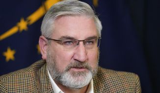Indiana Gov. Eric Holcomb speaks during a media availability from the Statehouse, Tuesday, Jan. 5, 2021, in Indianapolis. (AP Photo/Darron Cummings)