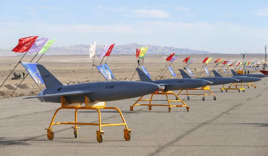 In this photo released on Tuesday, Jan. 5, 2021, by the Iranian army, drones are displayed prior to a drill, in an undisclosed location in Iran. The Iranian military began a wide-ranging, two-day aerial rill in the country&#39;s north, state media reported, featuring combat and surveillance unmanned aircraft, as well as naval drones dispatched from vessels in Iran&#39;s southern waters. (Iranian Army via AP) ** FILE **