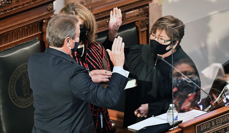 Kentucky Supreme Court Justice Sarah Combs swears in David Osborne as Speaker of The House in Frankfort, Ky., Tuesday, Jan. 5, 2021. (AP Photo/Timothy D. Easley)