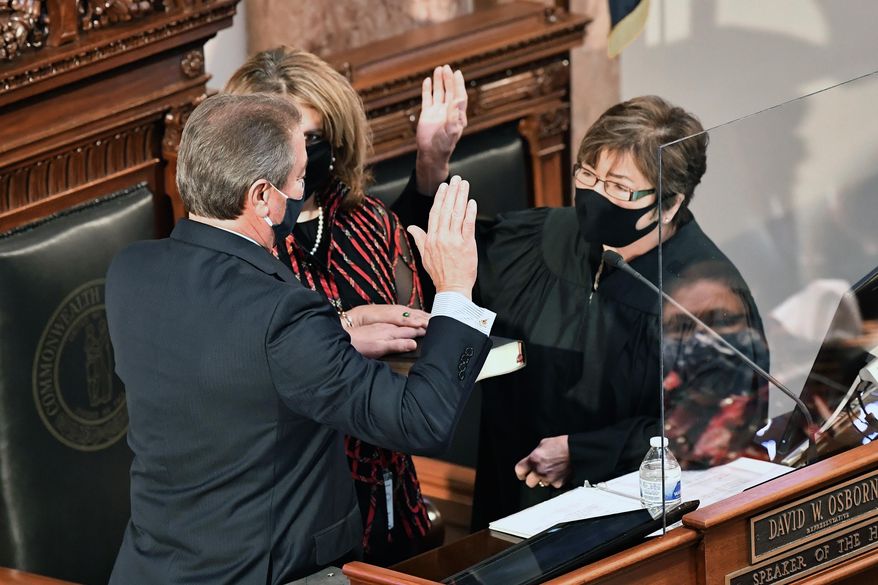 Kentucky Supreme Court Justice Sarah Combs swears in David Osborne as Speaker of The House in Frankfort, Ky., Tuesday, Jan. 5, 2021. (AP Photo/Timothy D. Easley)