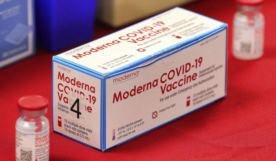 A box of vials of the Moderna vaccine for the COVID-19 coronavirus on display during a press conference with Florida governor Ron DeSantis touting the expanded rollout of the state vaccination program, at Orlando Health South Seminole Hospital in Longwood, Fla., Monday, Jan. 4, 2021. (Joe Burbank/Orlando Sentinel via AP)