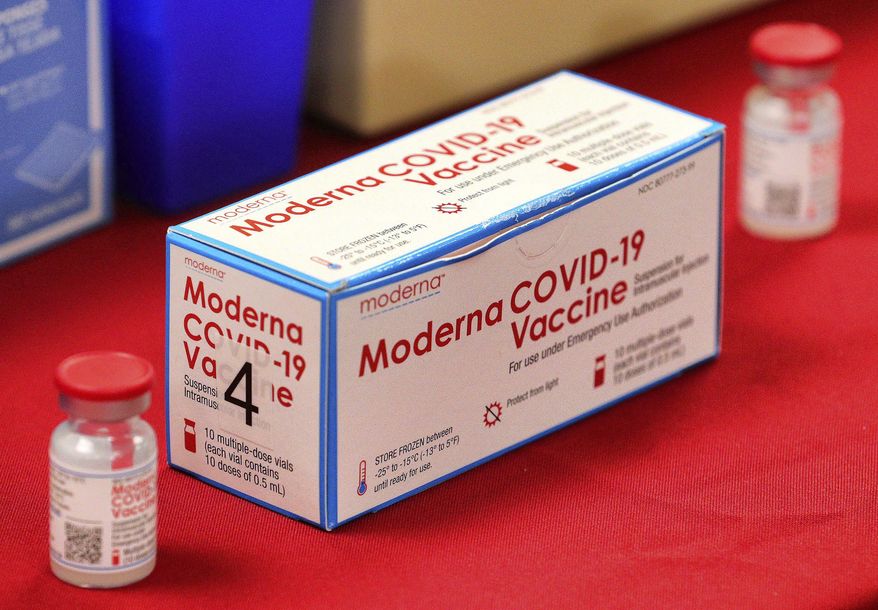 A box of vials of the Moderna vaccine for the COVID-19 coronavirus on display during a press conference with Florida governor Ron DeSantis touting the expanded rollout of the state vaccination program, at Orlando Health South Seminole Hospital in Longwood, Fla., Monday, Jan. 4, 2021. (Joe Burbank/Orlando Sentinel via AP)