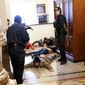 U.S. Capitol Police hold protesters at gun-point near the House Chamber inside the U.S. Capitol on Wednesday, Jan. 6, 2021, in Washington. (AP Photo/Andrew Harnik)