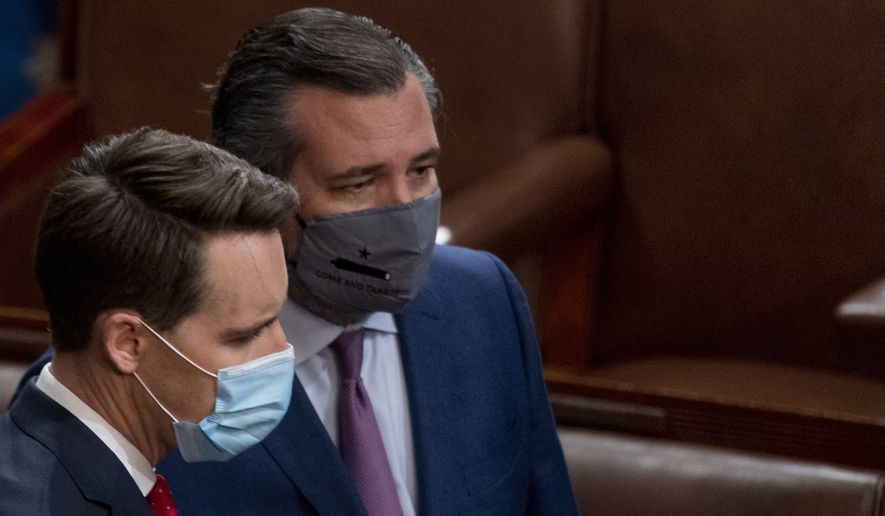 Sen. Josh Hawley, R-Mo., left, and Sen. Ted Cruz, R-Texas, right, speak after Republicans objected to certifying the Electoral College votes from Arizona, during a joint session of the House and Senate to confirm the electoral votes cast in November&#39;s election, at the Capitol, Wednesday, Jan 6, 2021. (AP Photo/Andrew Harnik) **FILE**
