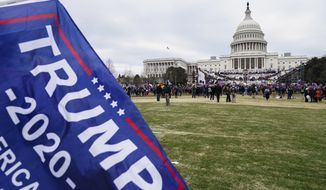 Trump supporters gather outside the Capitol, Wednesday, Jan. 6, 2021, in Washington. As Congress prepares to affirm President-elect Joe Biden&#39;s victory, thousands of people have gathered to show their support for President Donald Trump and his claims of election fraud. (AP Photo/John Minchillo)