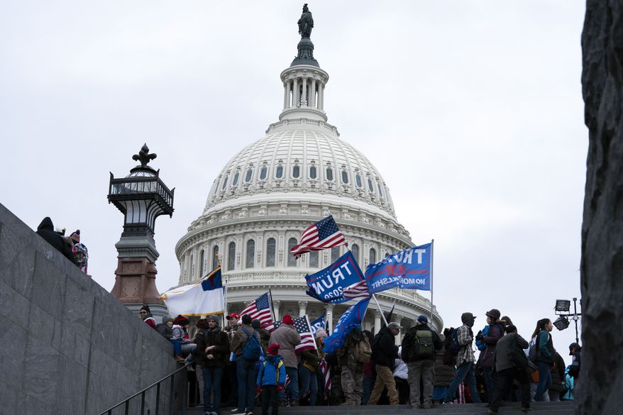 Supporters of President Donald Trump rally outside of the U.S. Capitol on Wednesday, Jan. 6, 2021, in Washington. (AP Photo/Jose Luis Magana)