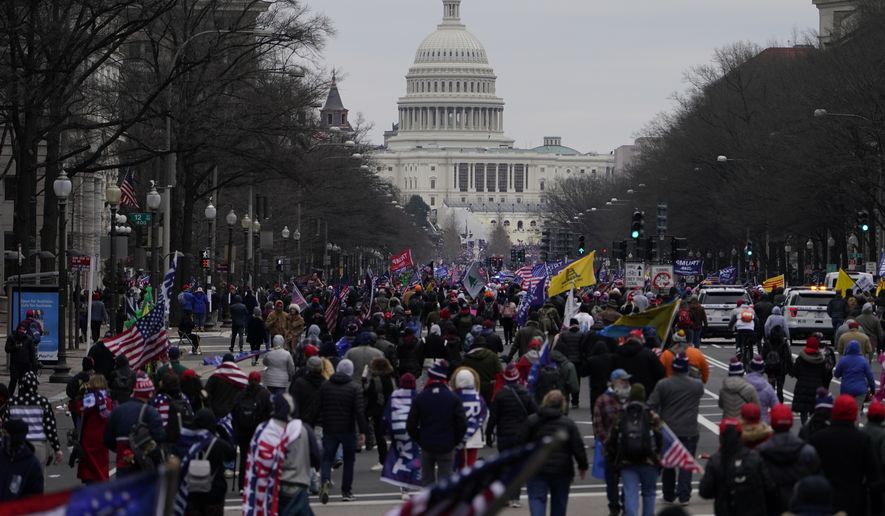 Supporters of President Donald Trump march on Pennsylvania Avenue towards the U.S. Capitol, Wednesday, Jan. 6, 2021, in Washington. (AP Photo/Jacquelyn Martin)