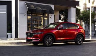 This photo provided by Mazda shows the 2021 Mazda CX-5, one of Edmunds&#39; top-rated compact crossovers. The CX-5 is notable for its sharp styling, excellent handling and luxurious interior materials. (Courtesy of Mazda North American Operations via AP)