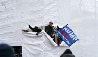 Trump supporters gather outside the Capitol, Wednesday, Jan. 6, 2021, in Washington. As Congress prepares to affirm President-elect Joe Biden&#39;s victory, thousands of people have gathered to show their support for President Donald Trump and his claims of election fraud. (AP Photo/Jose Luis Magana)