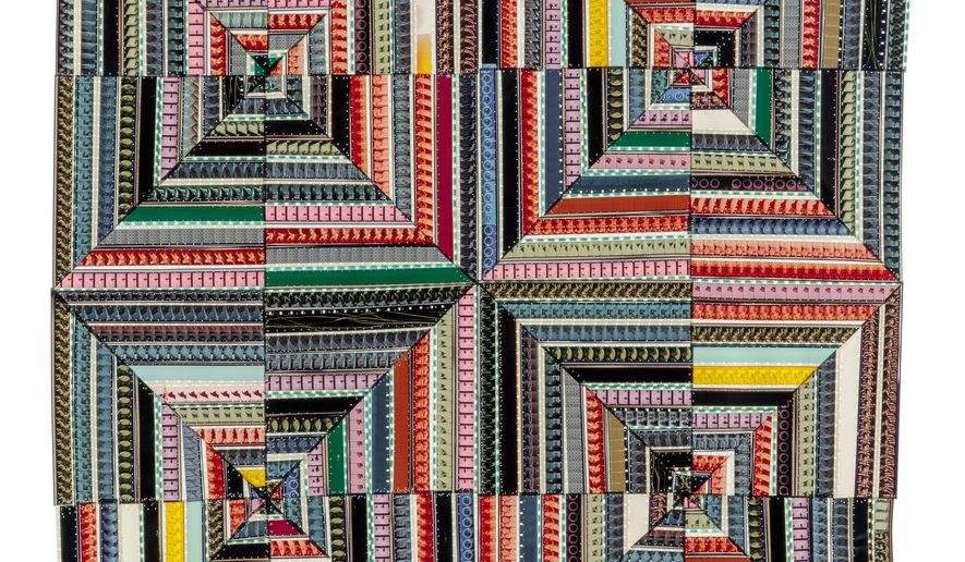 This image provided by Sabrina Gschwandtner shows a quilt entitled "Hands at Work III". Los Angeles-based artist Sabrina Gschwandtner has created a quilt series stitching together 16 mm and 35 mm film strips and backlighting them with a lightbox to illuminate the patterns. She began the project, "Hands at Work," in 2009 when a friend gave her some film being cleared out of the Fashion Institute of Technology's Anthology Film Archives. (Sabrina Gschwandtner/Joshua White via AP)