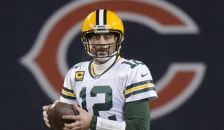 Green Bay Packers&#39; Aaron Rodgers looks to pass during the second half of an NFL football game against the Chicago Bears Sunday, Jan. 3, 2021, in Chicago. (AP Photo/Nam Y. Huh)