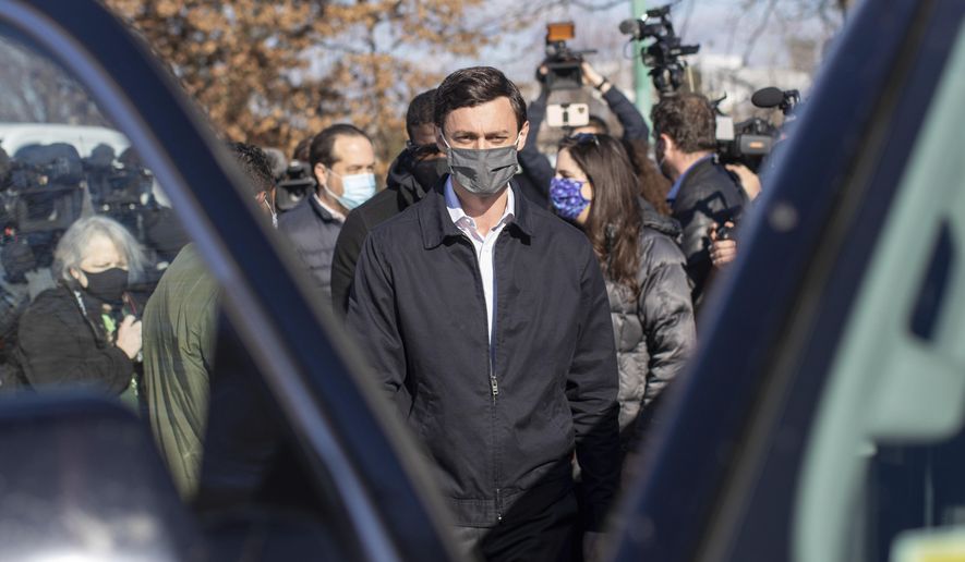 Democratic U.S. Senate challenger Jon Ossoff speaks to the media at Dunbar Neighborhood Center during Georgia's Senate runoff elections, Tuesday, Jan. 5, 2021, in Atlanta. (AP Photo/Branden Camp)