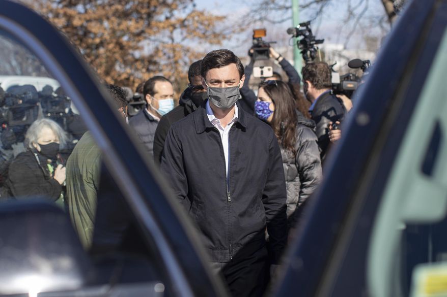 Democratic U.S. Senate challenger Jon Ossoff speaks to the media at Dunbar Neighborhood Center during Georgia's Senate runoff elections, Tuesday, Jan. 5, 2021, in Atlanta. (AP Photo/Branden Camp)