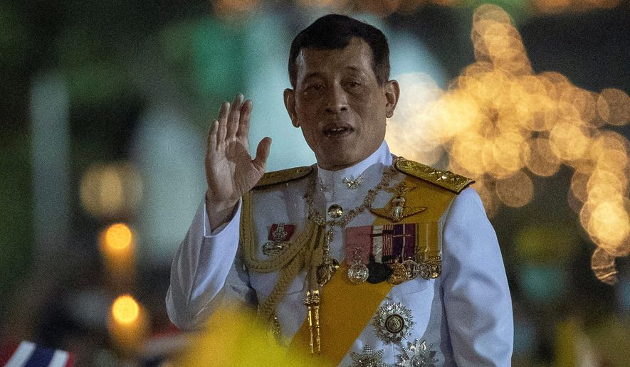 Thai King Maha Vajiralongkorn, 68, faces a balancing act to maintain his position of strength during 2021 while trying to adapt to an increasingly international public spotlight.
greets supporters as he walks to participate in a candle lighting ceremony to mark the anniversary of the birth of late King Bhumibol Adulyadej at Sanam Luang ceremonial ground in Bangkok, Thailand, Saturday, Dec. 5, 2020. Thousands of yellow-clad supporters greeted Thailand&#x27;s king in Bangkok on Saturday as he led a birthday commemoration for his revered late father, the latest in a series of public appearances at a time of unprecedented challenge to the monarchy from student-led protesters.(AP Photo/Gemunu Amarasinghe) (ASSOCIATED PRESS PHOTOGRAPHS)