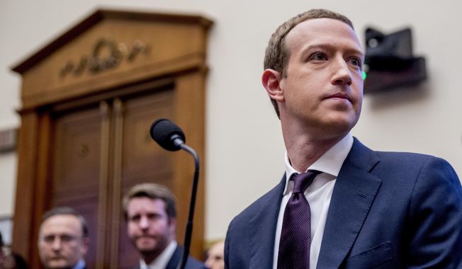 In this Wednesday, Oct. 23, 2019, file photo, Facebook CEO Mark Zuckerberg arrives for a House Financial Services Committee hearing on Capitol Hill in Washington, on Facebook&#x27;s impact on the financial services and housing sectors.  (AP Photo/Andrew Harnik, File)  **FILE**