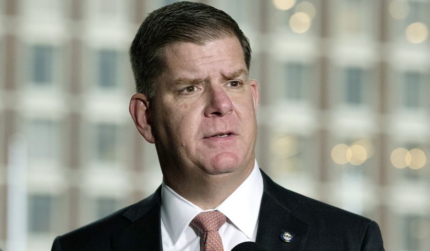 In this March 13, 2020, file photo, Boston Mayor Marty Walsh talks about the postponement of the Boston Marathon during a news conference, in Boston. President-elect Joe Biden has selected Walsh as his labor secretary, choosing a former union worker who shares his Irish American background and working-class roots. The 53-year-old Walsh has served as the Democratic mayor of Boston since 2014. (AP Photo/Michael Dwyer)