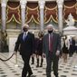 Senate Sergeant-at-Arms Michael Stenger, right, escorts Vice President Mike Pence to the House chamber for the the final certification of Electoral College votes cast in November's presidential election, at the Capitol in Washington, Thursday, Jan. 7, 2021. Violent protesters loyal to President Donald Trump stormed the Capitol Wednesday, disrupting the Electoral College process. (AP Photo/J. Scott Applewhite)